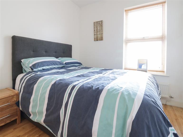 This is a bedroom at 21 West End Point in Pwllheli