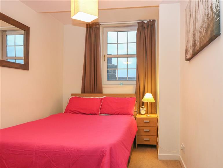 This is a bedroom at Harbour View Apartment in Aberdeen