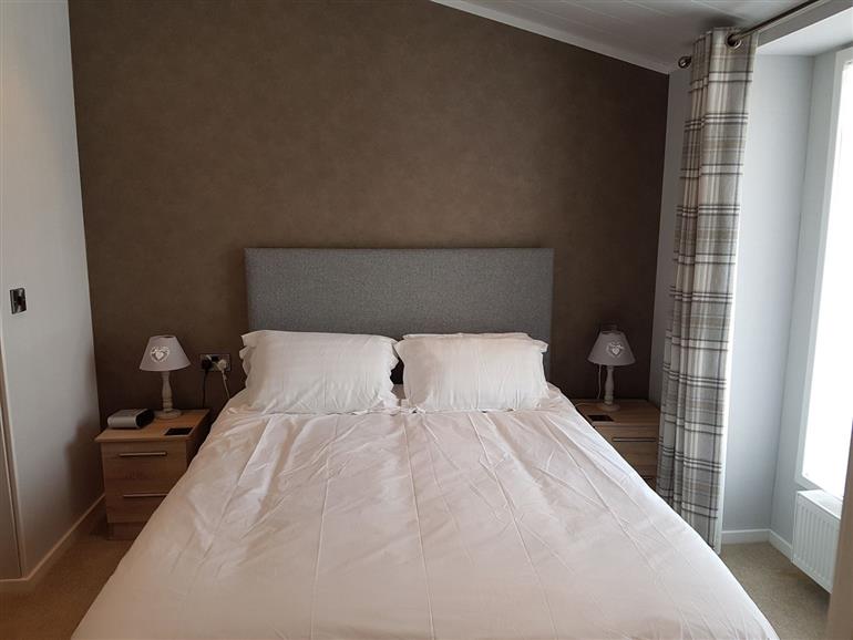 This is a bedroom at Mereside in South lakeland Leisure Village near Carnforth