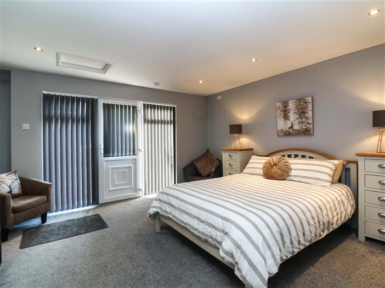 One of the bedrooms at Studio Apartment in Minehead