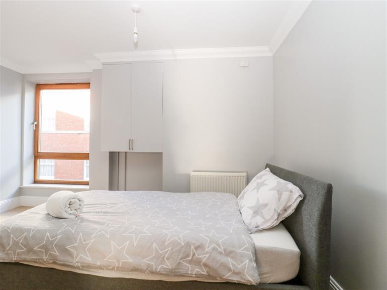 This is a bedroom at Townbridge Apartment in Weymouth
