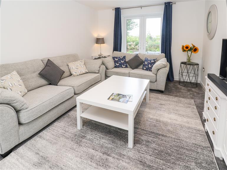 This is the living room at 20 The Walled Garden in Kenrick near Penryn