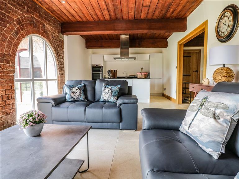 The living room at 9 Nantcribba Barns in Welshpool