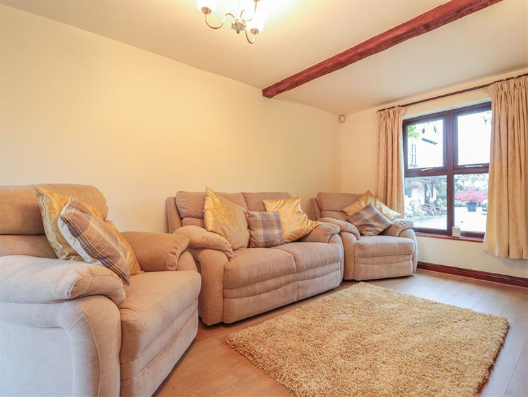 The living room at Berrys Place Farm Annexe in Churcham