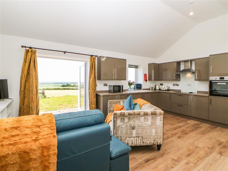 The living room at Blackthorn Cottage in Borrowby
