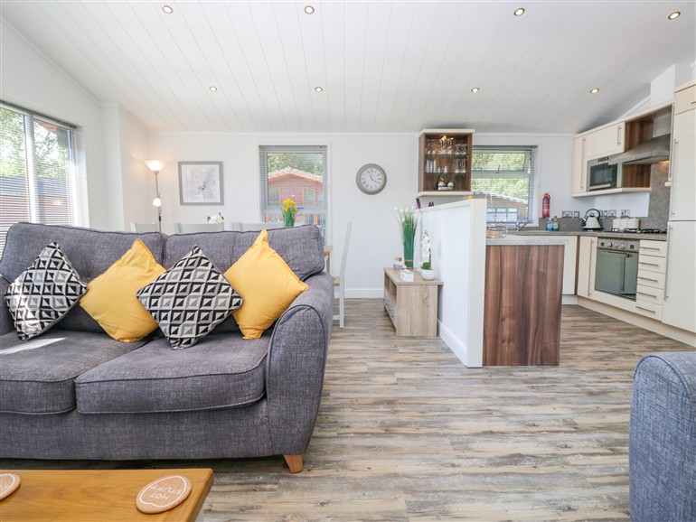 The living room at Dovedale Lodge in White Cross Bay Holiday Park near Troutbeck Bridge