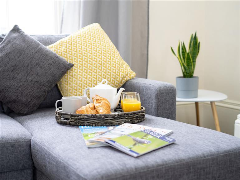 This is the living room at First Floor Apartment in Cheltenham