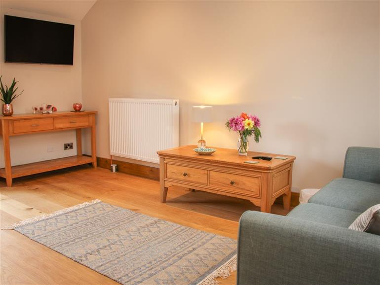 This is the living room at Meadow Barn in Aston On Clun