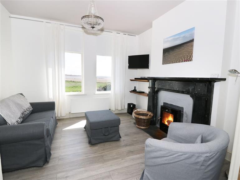 This is the living room at Pow-Wow Shore Cottage near Annan