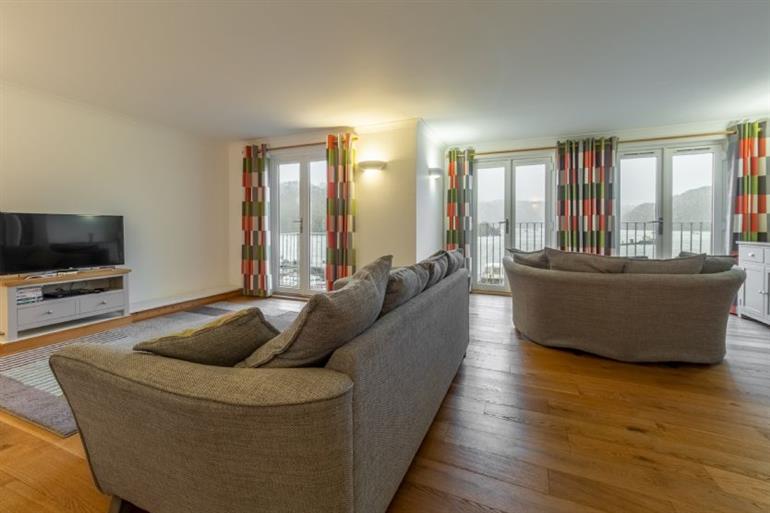 Sitting room with marina views at Waterfront House,