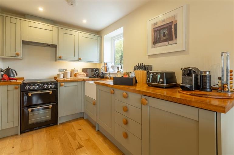 The fully-equipped kitchen area at 6 Sandy Lane, Carbis Bay in Cornwall